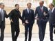 Emmanuel Macron, Friedrich Merz e Donald Tusk conversando com líderes europeus e ucranianos em visita oficial à Ucrânia em 2025.