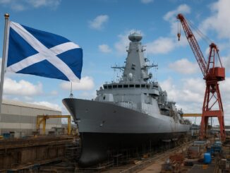 Navio militar moderno em estaleiro na Escócia, com a bandeira escocesa ao lado, simbolizando a indústria de defesa e tecnologia naval europeia.