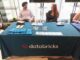 Estande da Databricks em evento de tecnologia, representando a expansão da empresa no Brasil e na América Latina.